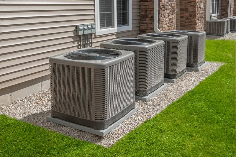 Multiple outdoor air conditioning units lined up.